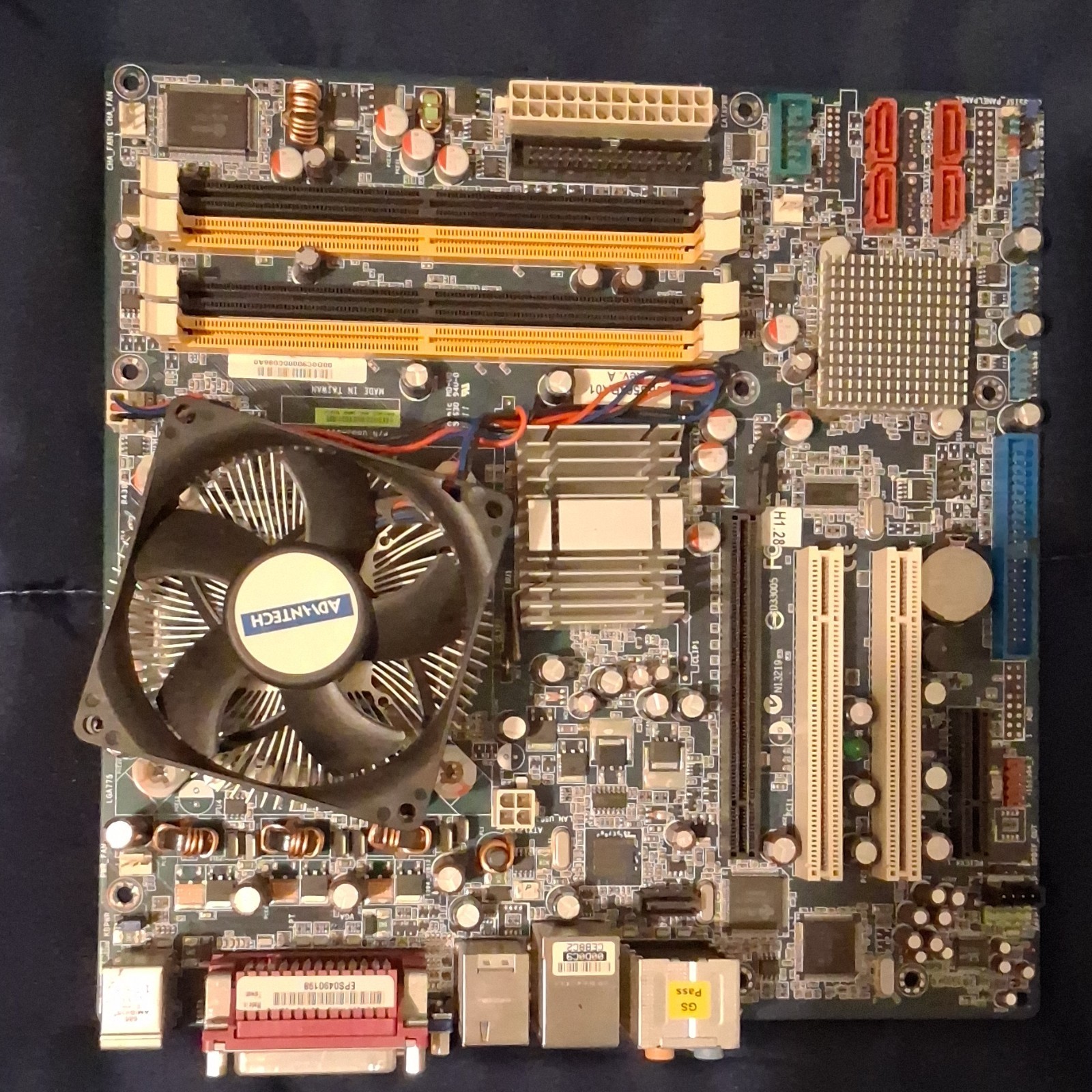 unknown brand motherboard, cpu combo with heatsink and cpu fan.